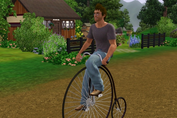 16 大きな車輪の自転車に乗って町を散策